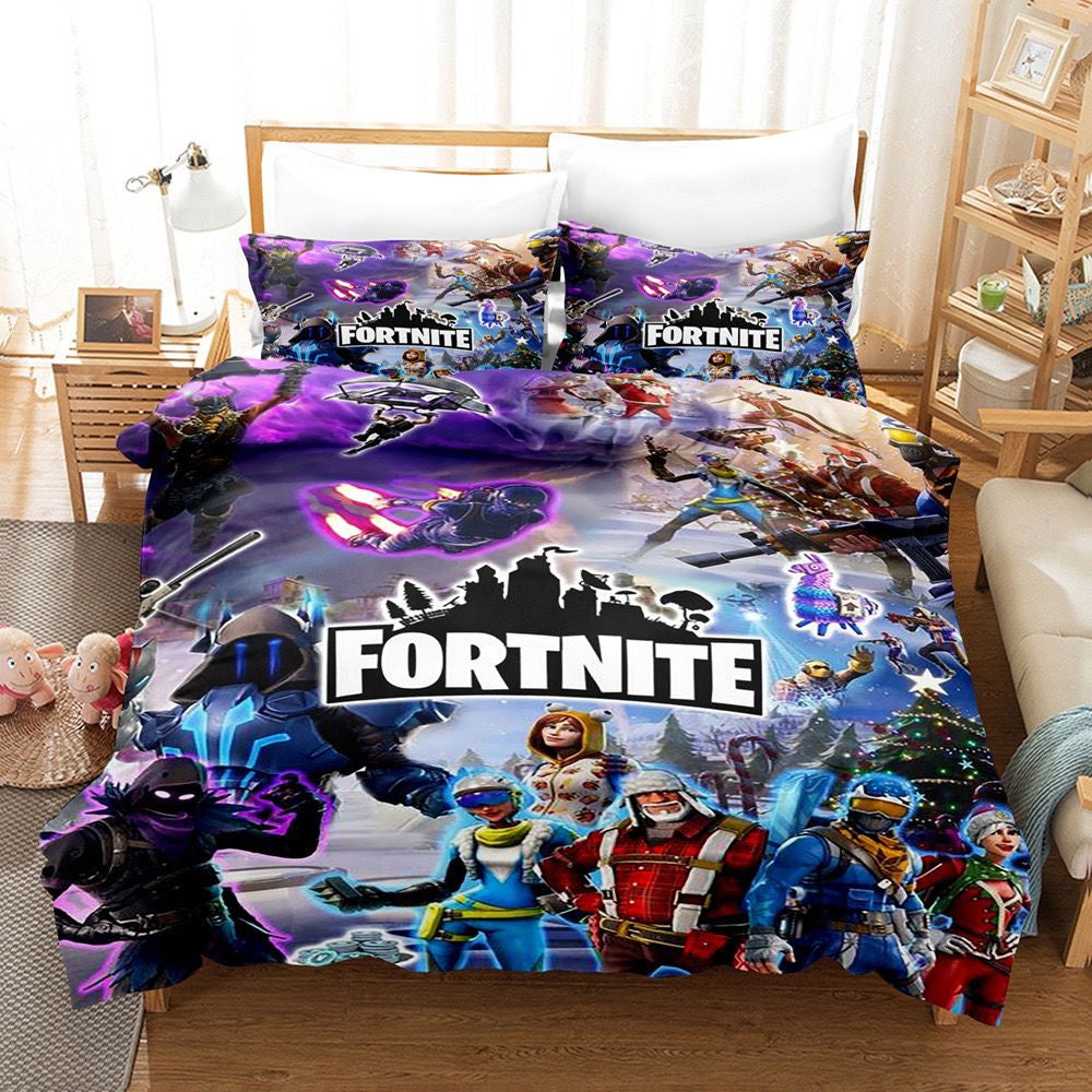 A bedding set with a Fortnite video game theme, featuring characters and branding, displayed on a bed in a room.