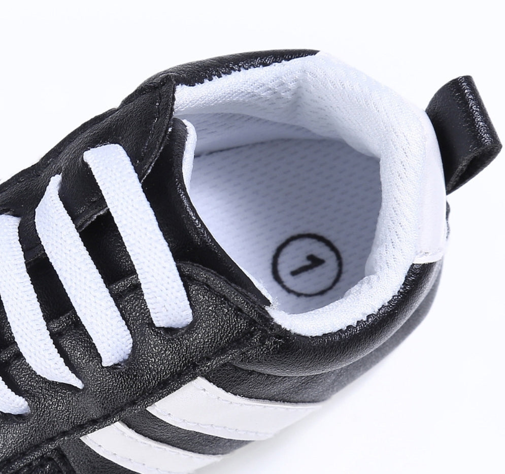 Black Sneakers with White Stripes